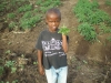 Child standing by Vegetables