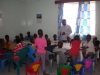 James (trustee) talking to children